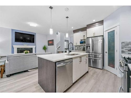 391 Bayview Way Sw, Airdrie, AB - Indoor Photo Showing Kitchen With Fireplace With Stainless Steel Kitchen With Upgraded Kitchen