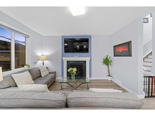 391 Bayview Way Sw, Airdrie, AB - Indoor Photo Showing Living Room With Fireplace