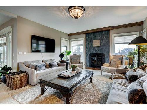 88091 Red Fox Lane West, Rural Foothills County, AB - Indoor Photo Showing Living Room With Fireplace