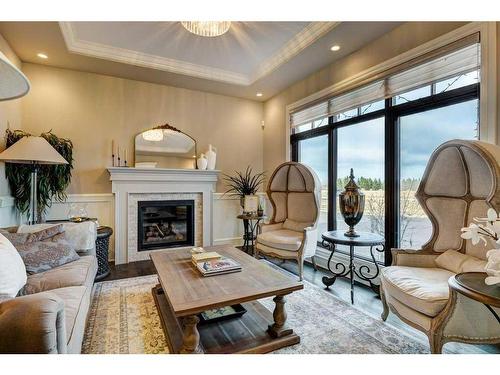 88091 Red Fox Lane West, Rural Foothills County, AB - Indoor Photo Showing Living Room With Fireplace