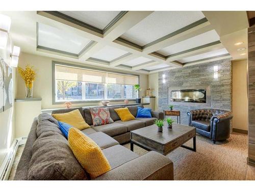 2307-402 Kincora Glen Road Nw, Calgary, AB - Indoor Photo Showing Living Room With Fireplace