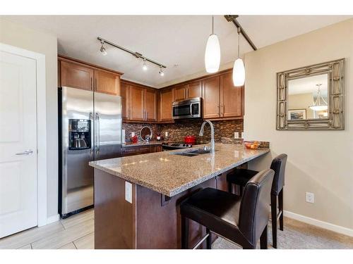 2307-402 Kincora Glen Road Nw, Calgary, AB - Indoor Photo Showing Kitchen With Double Sink