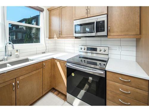 338 Evansglen Drive Nw, Calgary, AB - Indoor Photo Showing Kitchen With Double Sink