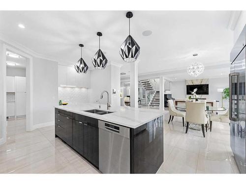 102 Malibou Road Sw, Calgary, AB - Indoor Photo Showing Kitchen With Double Sink With Upgraded Kitchen