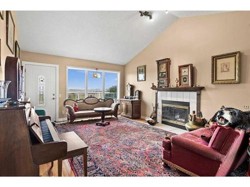 260159 Mountain Ridge Place, Rural Rocky View County, AB - Indoor Photo Showing Living Room With Fireplace