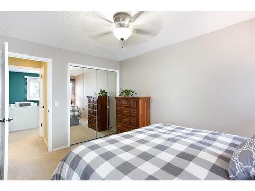 424 Flett Drive Ne, Airdrie, AB - Indoor Photo Showing Bedroom