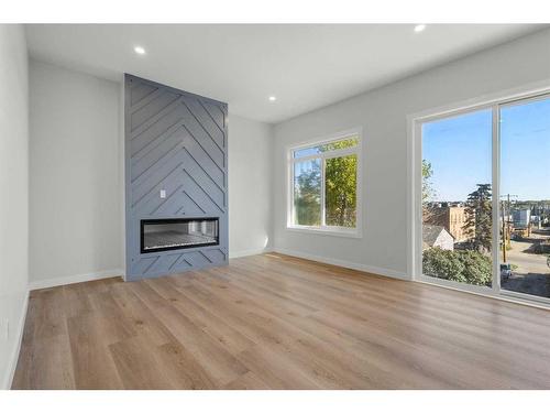 3812 Centre A Street Ne, Calgary, AB - Indoor Photo Showing Living Room With Fireplace