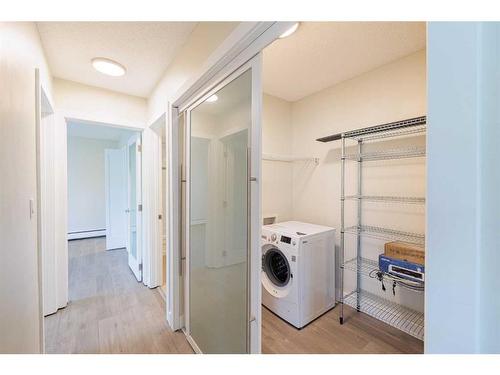 102-1810 16 Street Sw, Calgary, AB - Indoor Photo Showing Laundry Room