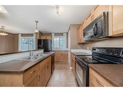 151 Prestwick Villas Se, Calgary, AB - Indoor Photo Showing Kitchen With Double Sink