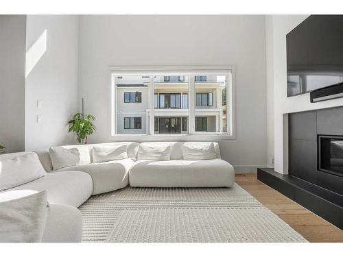 136 Crestridge Terrace Sw, Calgary, AB - Indoor Photo Showing Living Room With Fireplace