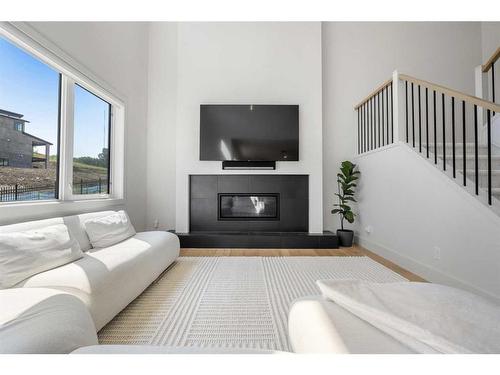 136 Crestridge Terrace Sw, Calgary, AB - Indoor Photo Showing Living Room With Fireplace