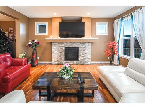 88 Walden Terrace Se, Calgary, AB - Indoor Photo Showing Living Room With Fireplace