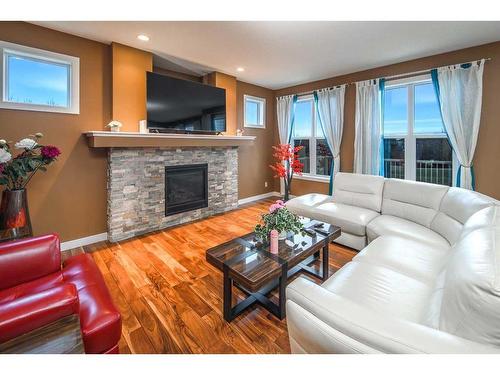 88 Walden Terrace Se, Calgary, AB - Indoor Photo Showing Living Room With Fireplace