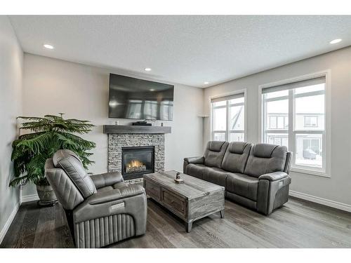 34 Mahogany Close Se, Calgary, AB - Indoor Photo Showing Living Room With Fireplace