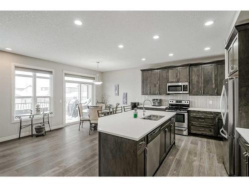 34 Mahogany Close Se, Calgary, AB - Indoor Photo Showing Kitchen With Stainless Steel Kitchen With Double Sink With Upgraded Kitchen