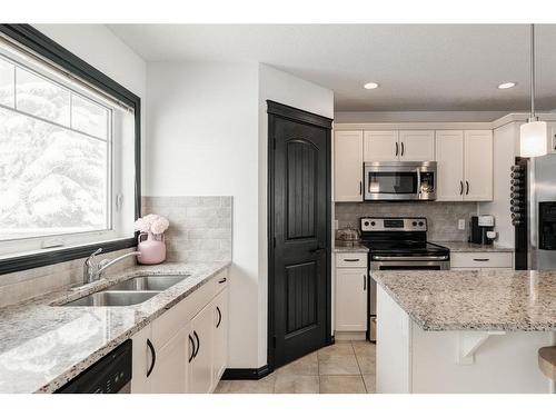 224 Cranberry Park Se, Calgary, AB - Indoor Photo Showing Kitchen With Stainless Steel Kitchen With Double Sink With Upgraded Kitchen