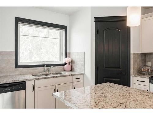 224 Cranberry Park Se, Calgary, AB - Indoor Photo Showing Kitchen With Double Sink