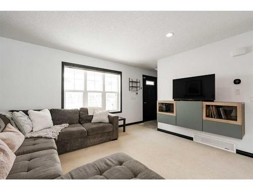 224 Cranberry Park Se, Calgary, AB - Indoor Photo Showing Living Room