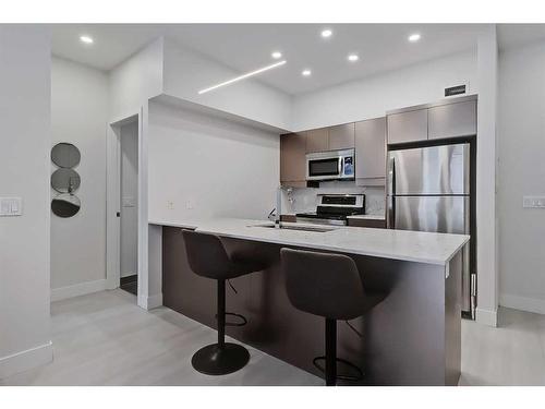 312-4303 1 Street Ne, Calgary, AB - Indoor Photo Showing Kitchen With Stainless Steel Kitchen