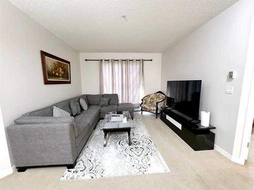 1310-333 Taravista Drive Ne, Calgary, AB - Indoor Photo Showing Living Room