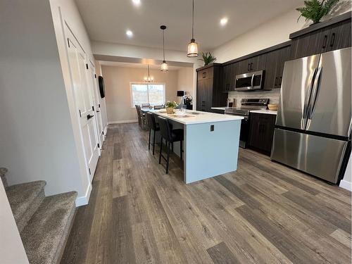 113 Gray Close, Sylvan Lake, AB - Indoor Photo Showing Kitchen With Upgraded Kitchen