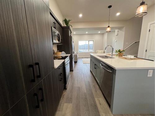 113 Gray Close, Sylvan Lake, AB - Indoor Photo Showing Kitchen With Double Sink With Upgraded Kitchen