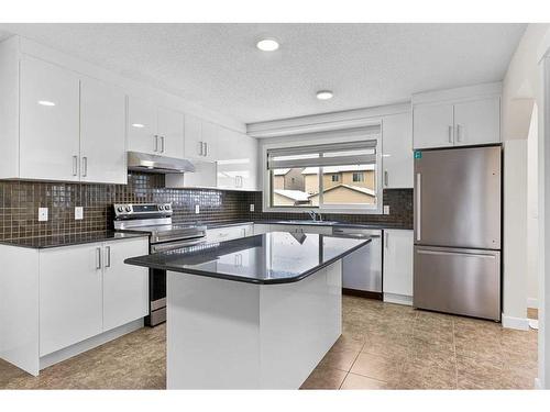 26 Luxstone Point Sw, Airdrie, AB - Indoor Photo Showing Kitchen With Stainless Steel Kitchen With Upgraded Kitchen