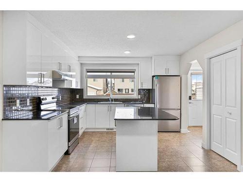 26 Luxstone Point Sw, Airdrie, AB - Indoor Photo Showing Kitchen With Stainless Steel Kitchen With Upgraded Kitchen