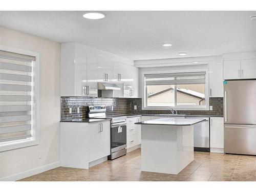 26 Luxstone Point Sw, Airdrie, AB - Indoor Photo Showing Kitchen With Stainless Steel Kitchen With Upgraded Kitchen