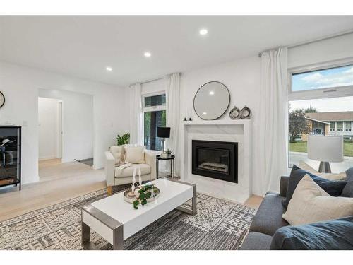 507 Cantrell Drive Sw, Calgary, AB - Indoor Photo Showing Living Room With Fireplace