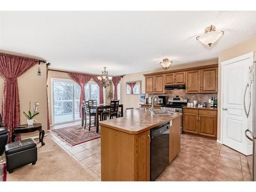 47 Panamount Heights Nw, Calgary, AB - Indoor Photo Showing Kitchen With Double Sink