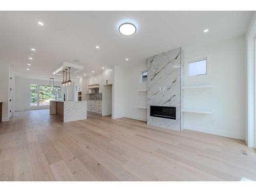 33 Harvard Street Nw, Calgary, AB - Indoor Photo Showing Living Room With Fireplace