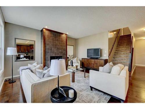 83 Mahogany Way Se, Calgary, AB - Indoor Photo Showing Living Room With Fireplace