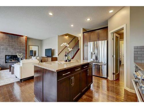 83 Mahogany Way Se, Calgary, AB - Indoor Photo Showing Kitchen With Fireplace