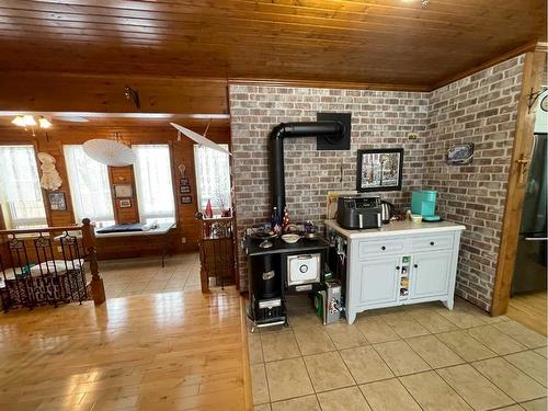 2130 19 Avenue, Didsbury, AB - Indoor With Fireplace