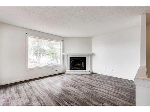 804 44 Street Se, Calgary, AB - Indoor Photo Showing Living Room With Fireplace