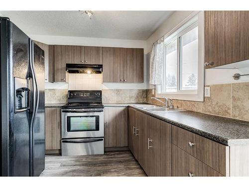 804 44 Street Se, Calgary, AB - Indoor Photo Showing Kitchen With Double Sink