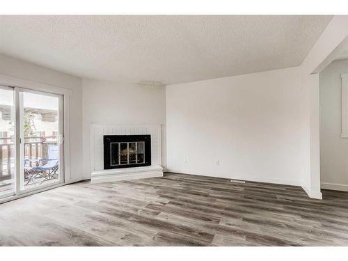 804 44 Street Se, Calgary, AB - Indoor Photo Showing Living Room With Fireplace