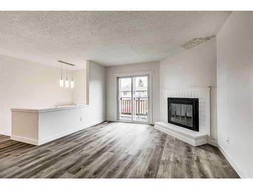 804 44 Street Se, Calgary, AB - Indoor Photo Showing Living Room With Fireplace