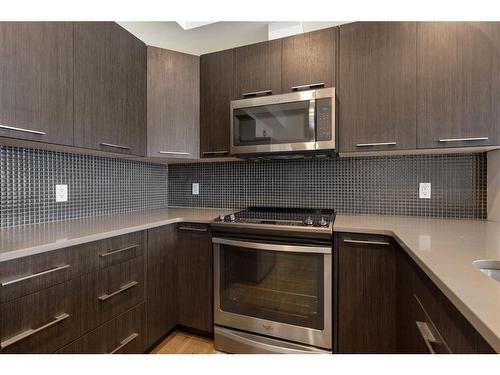 403-214 Sherwood Square Nw, Calgary, AB - Indoor Photo Showing Kitchen With Upgraded Kitchen