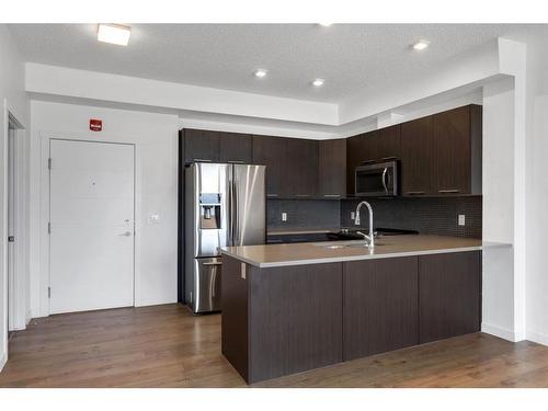 403-214 Sherwood Square Nw, Calgary, AB - Indoor Photo Showing Kitchen With Stainless Steel Kitchen