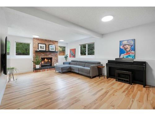 11 Oakmount Way Sw, Calgary, AB - Indoor Photo Showing Living Room With Fireplace