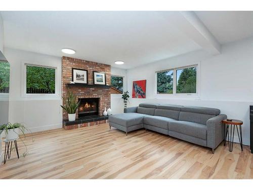 11 Oakmount Way Sw, Calgary, AB - Indoor Photo Showing Living Room With Fireplace