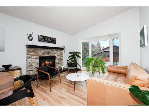 11 Oakmount Way Sw, Calgary, AB - Indoor Photo Showing Living Room With Fireplace