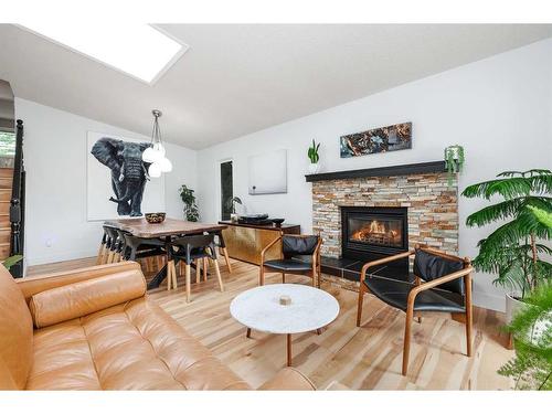 11 Oakmount Way Sw, Calgary, AB - Indoor Photo Showing Living Room With Fireplace