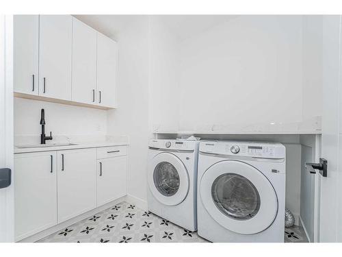 23 Watercrest Gate, Chestermere, AB - Indoor Photo Showing Laundry Room