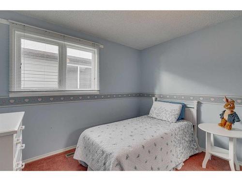 20 Riverbrook Place Se, Calgary, AB - Indoor Photo Showing Bedroom