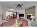 20 Riverbrook Place Se, Calgary, AB  - Indoor Photo Showing Living Room With Fireplace 