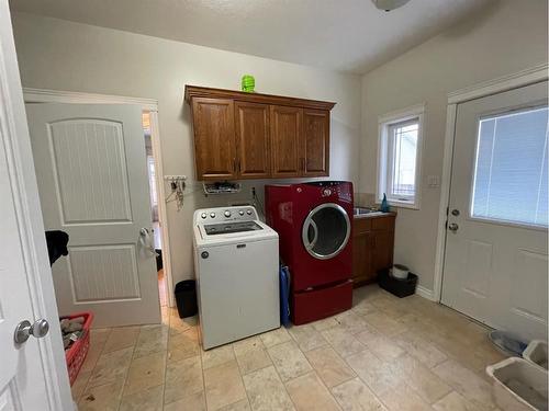 226 Harvest Hills Boulevard, Stavely, AB - Indoor Photo Showing Laundry Room