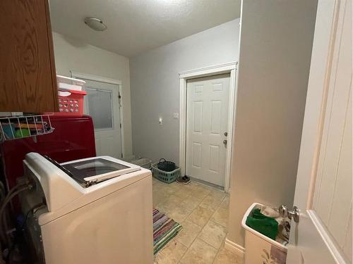 226 Harvest Hills Boulevard, Stavely, AB - Indoor Photo Showing Laundry Room